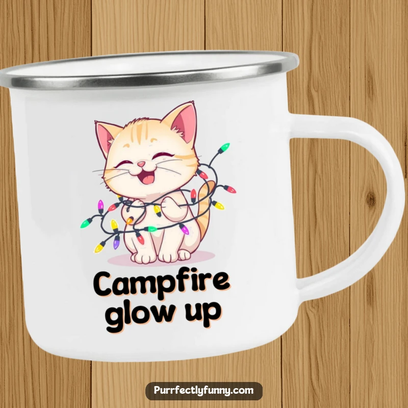 Funny camping mug showing a delighted cat tangled in colorful holiday lights, perfect for enjoying drinks with festive humor.