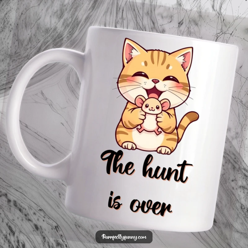 Funny mug showing a proud cat with a triumphant grin holding a tiny toy mouse, signifying victory.