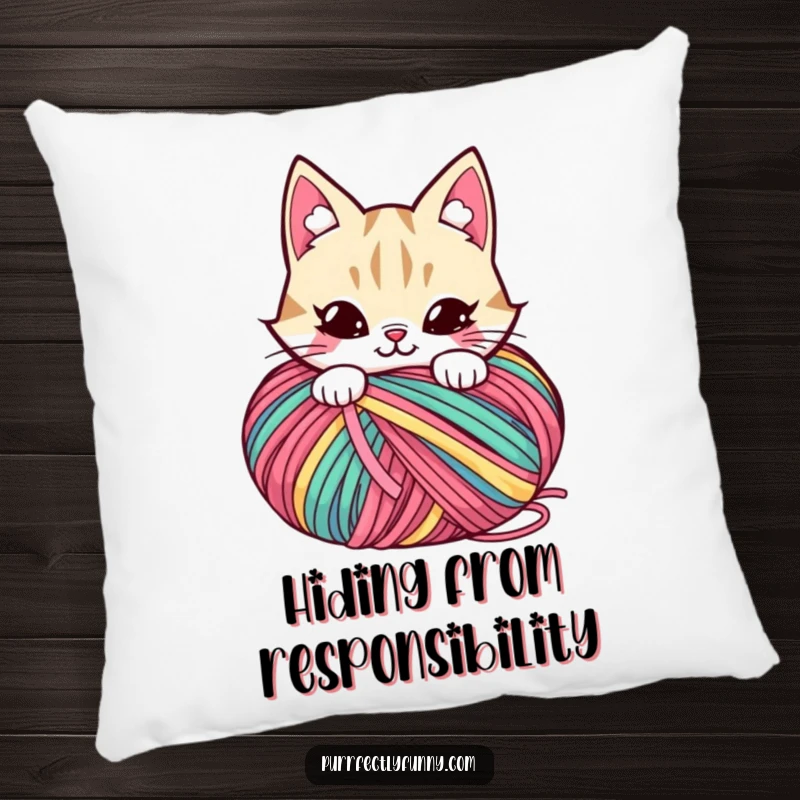 Funny pillow with a mischievous cat character peeking from behind a large, colorful ball of yarn.