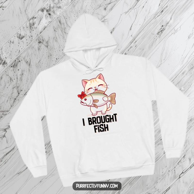 Funny cat hoodie showcasing a happy cat giving a giant fish, radiating warmth and humorous delight.