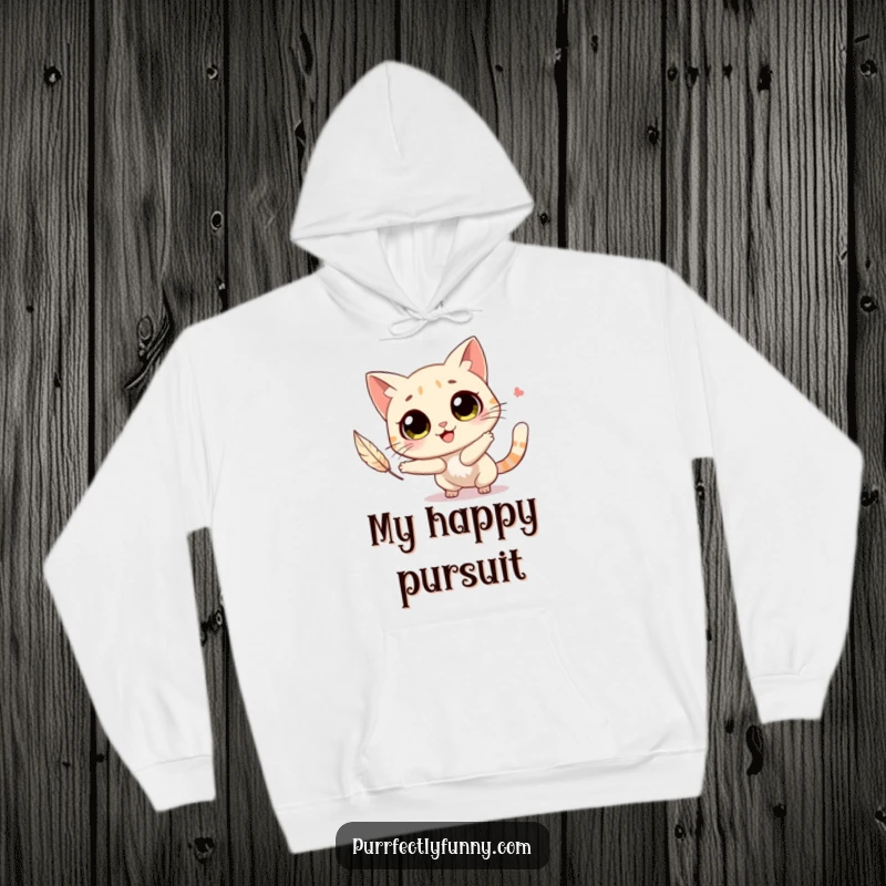 Funny cat with big, round eyes joyfully chasing a feather, featured on a warm and cuddly hoodie.