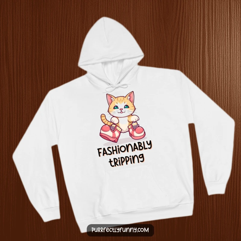 Funny, plush hoodie featuring a cat adorably tripping in gigantic clown shoes, capturing pure comedic charm.