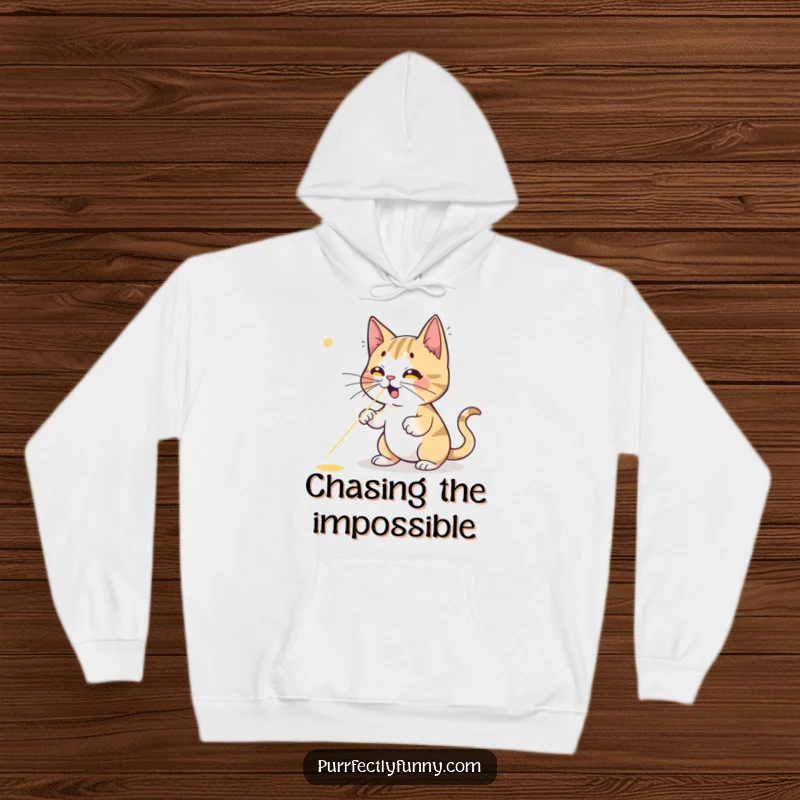 Funny cat hoodie, a cartoon feline comically failing to catch a bright red laser dot, emphasizing its amusing struggle and playful energy.