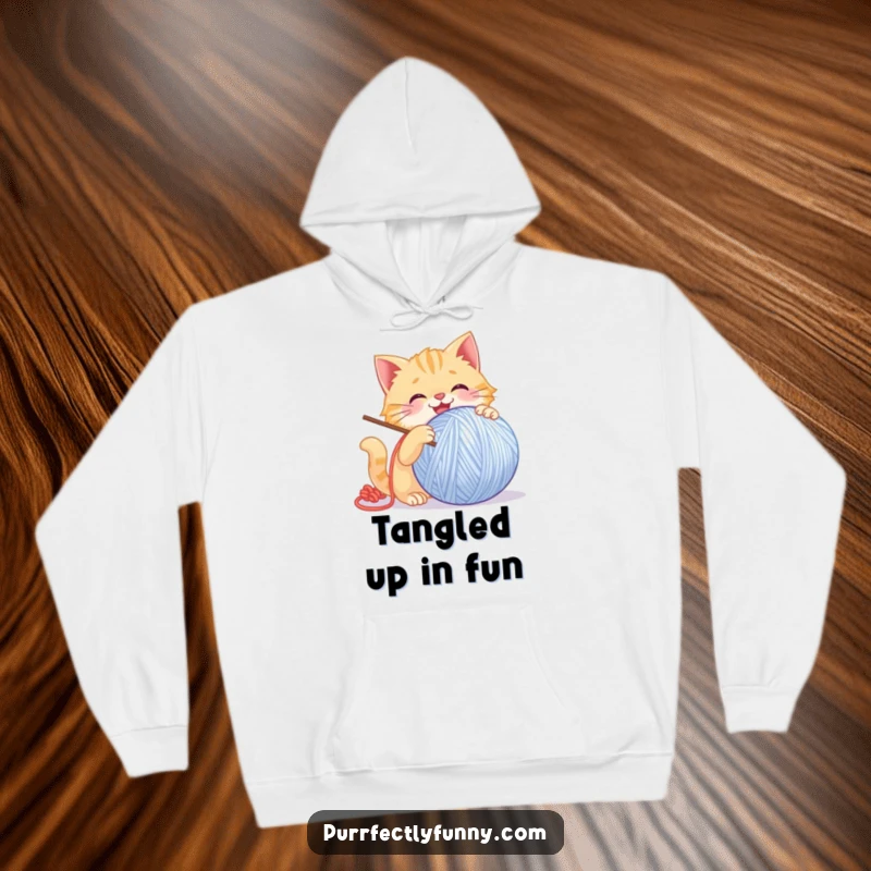 Funny Cat Hoodie: A warm hoodie with a funny illustration of a cat gleefully batting a giant, smiling ball of yarn.