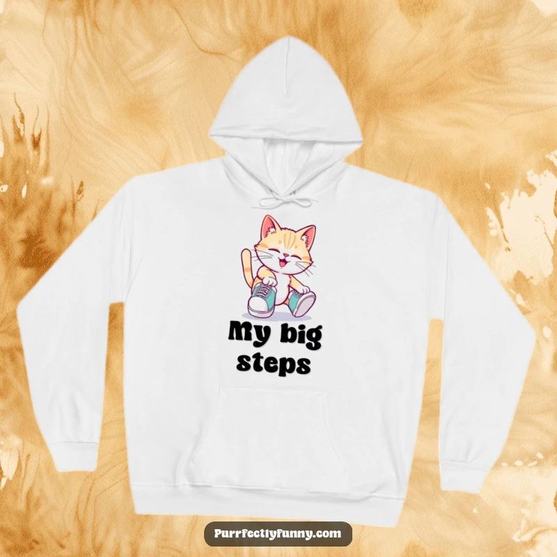 Funny cat wearing oversized shoes and tripping playfully on a warm and humorous funny hoodie.