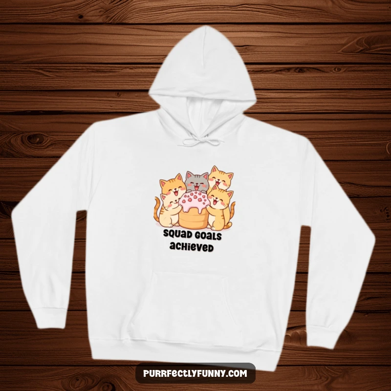 Funny hoodie featuring a gathering of cute cats delighting in a giant shared treat, cozy and humorous.