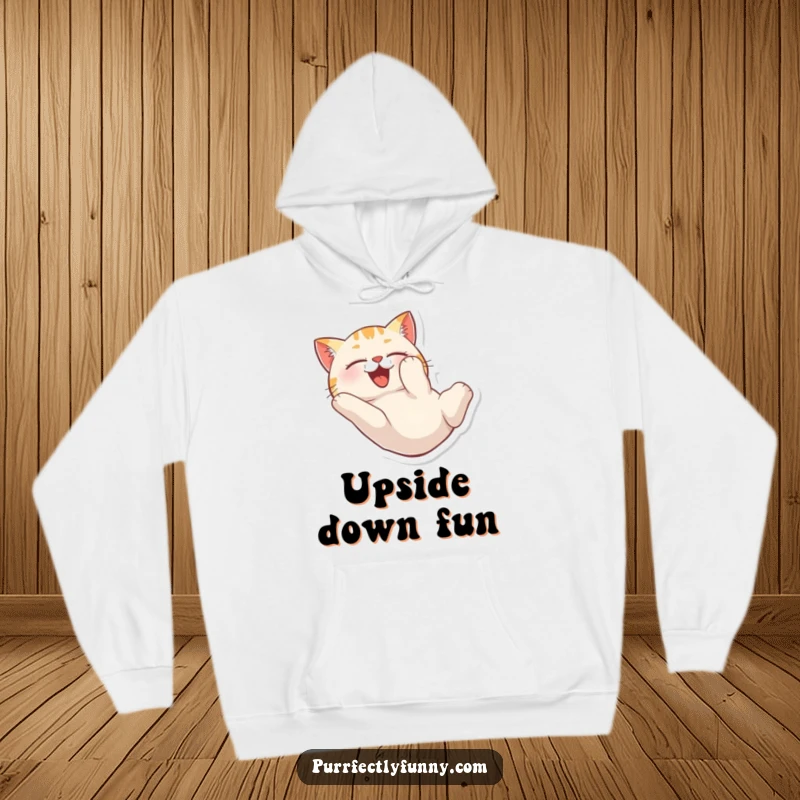 Funny hoodie depicting a cat tumbling head over heels with pure delight, cozy and whimsical.