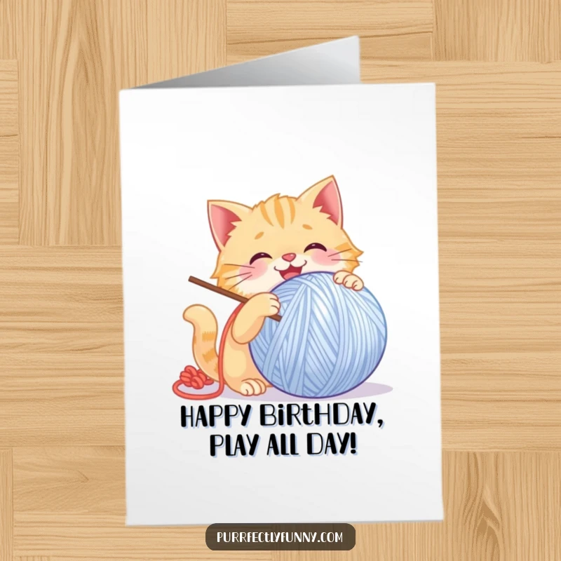 Funny Free Printable Birthday Card: Cat joyfully batting a giant, smiling ball of yarn with enthusiastic glee and playful energy.