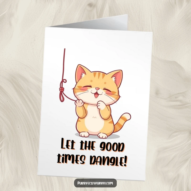 Funny Free Printable Birthday Card: A cat gleefully bats at a dangling string, full of playful energy.