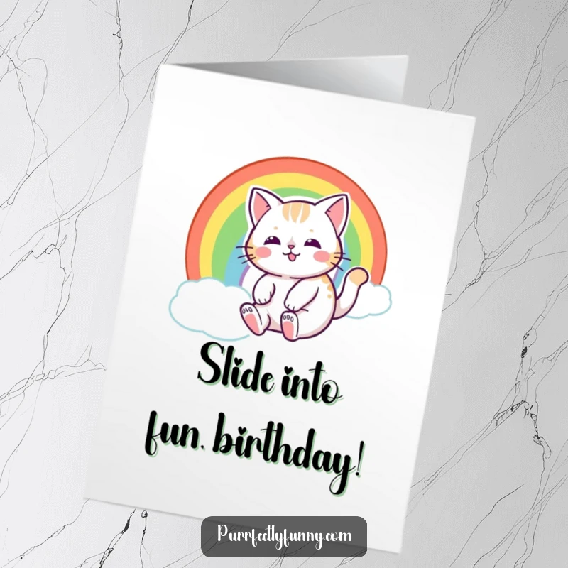 Funny Free Printable Birthday Card: A cat with a happy expression joyfully sliding down a vibrant rainbow.