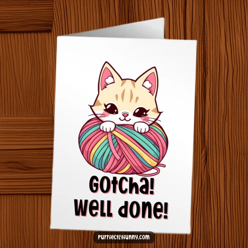 Funny Free Printable Congratulations Card: A cat peeking with a mischievous grin from behind a large ball of yarn.