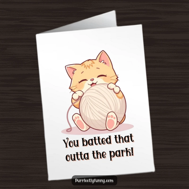 Funny Free Printable Congratulations Card: Amused cat batting a huge yarn ball, celebrating success with playful energy.