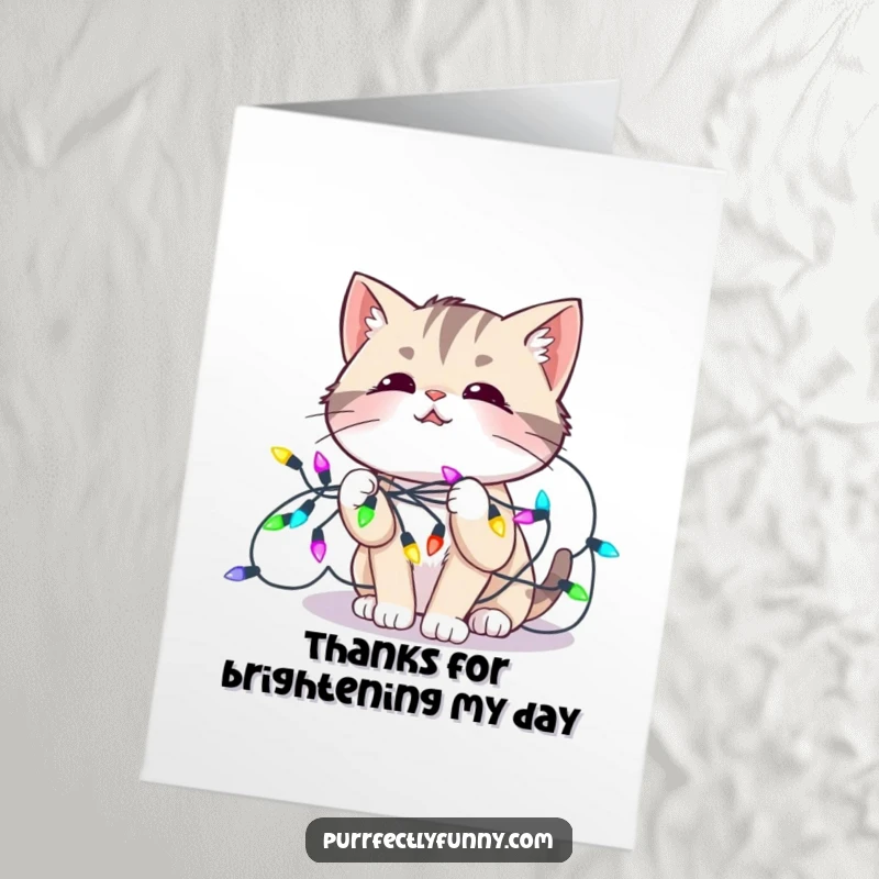 Funny Free Printable Thank You Card: Amused cat looking slightly bewildered while tangled in a string of colorful lights.