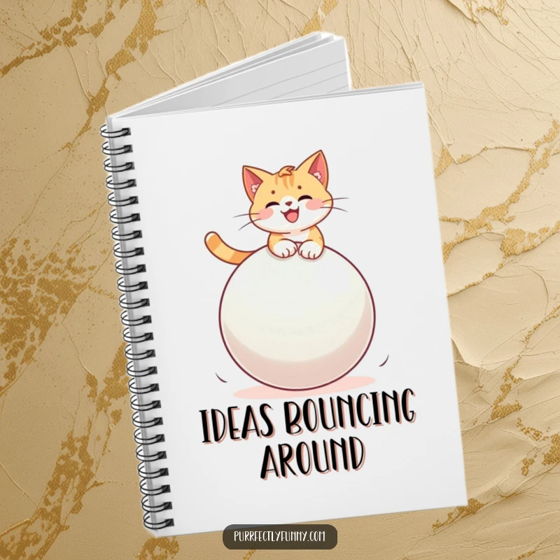 Funny cat in mid-air, joyfully riding a large bouncy ball, on the cover of a lined notebook for jotting down thoughts.
