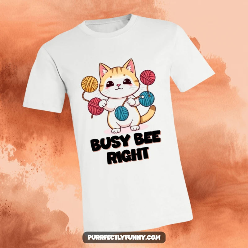 Funny t-shirt featuring a skilled cat juggling yarn balls with its paws and tail, highlighting its playful and multi-talented nature.