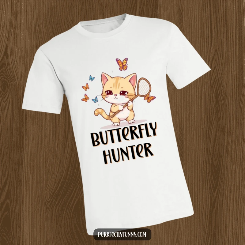 Funny t-shirt graphic of a goofy cat with a net, intensely focused on catching butterflies, looking endearingly clumsy and determined.