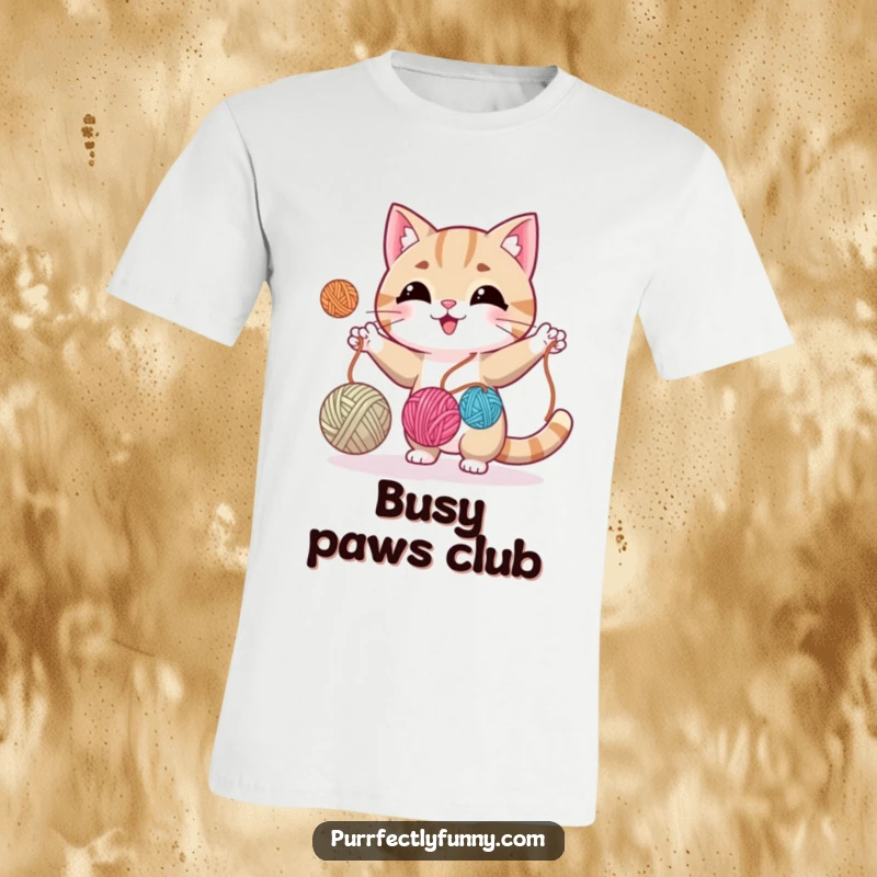 Funny cat expertly juggling three balls of yarn, looking mischievous and skilled on this whimsical t-shirt.