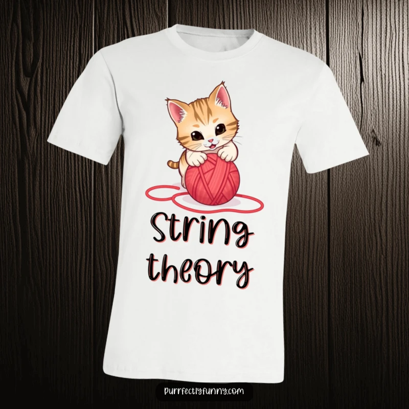 Funny t-shirt graphic of a cat in mid-air, playfully pouncing on a rolling red yarn ball, showcasing pure feline excitement.