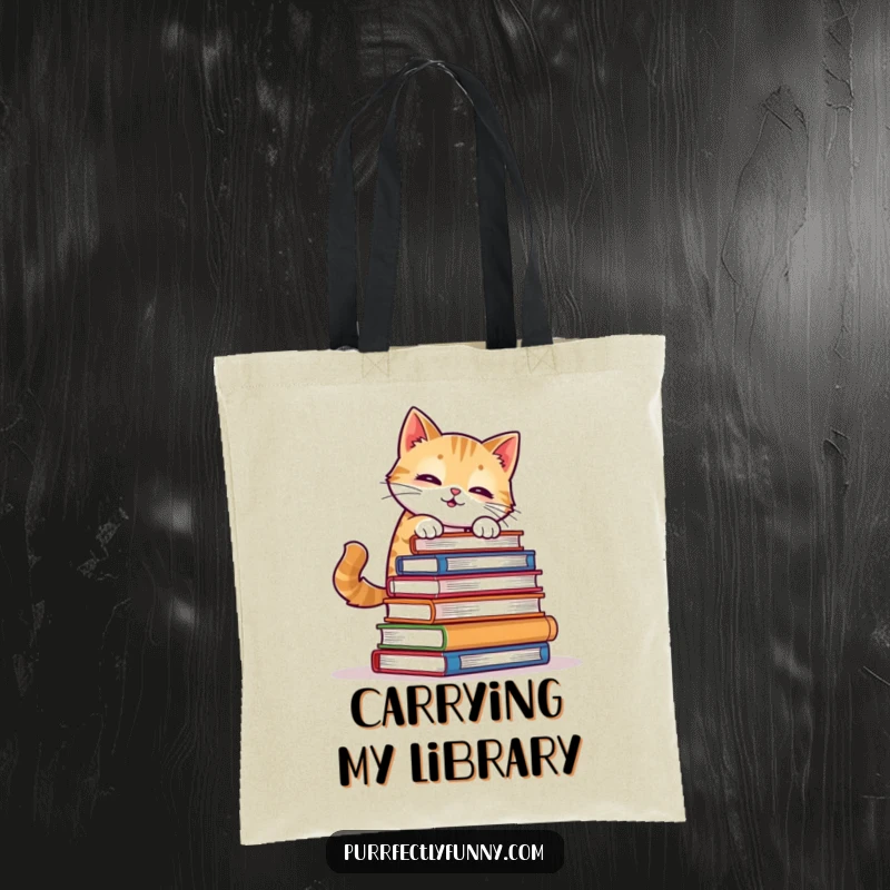 Funny Cat Tote Bag: A cat comically attempts to balance a tower of books, designed for literary enthusiasts who love a good laugh.