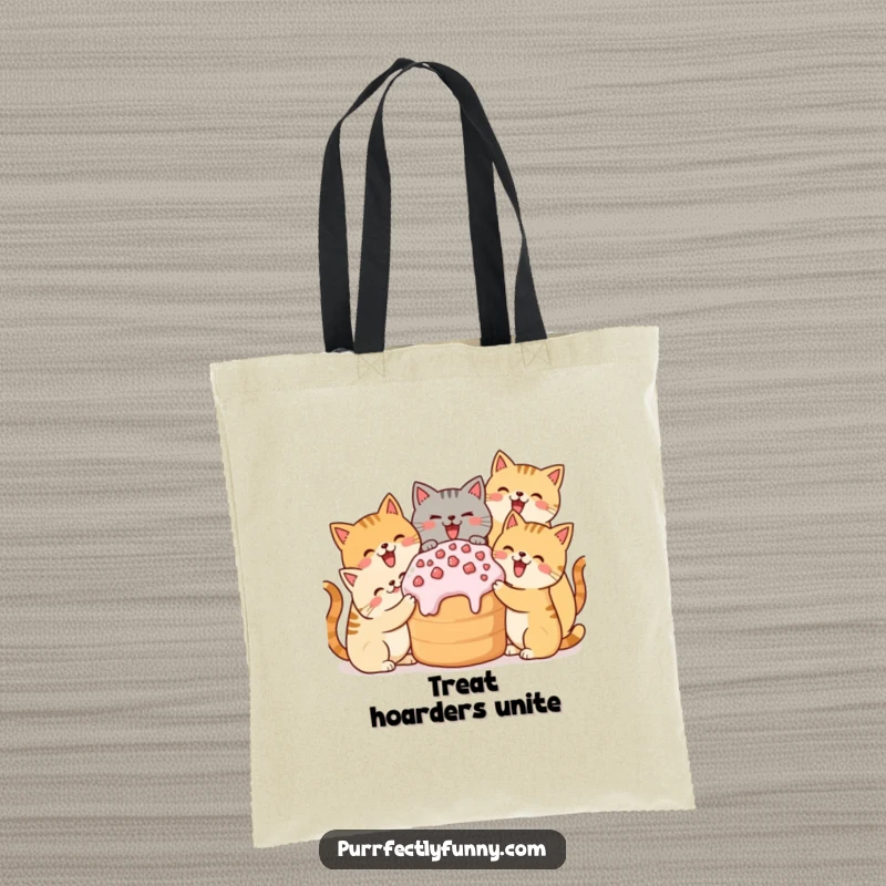 Funny tote bag depicting simplified cats joyfully sharing a large treat, ideal for carrying items.