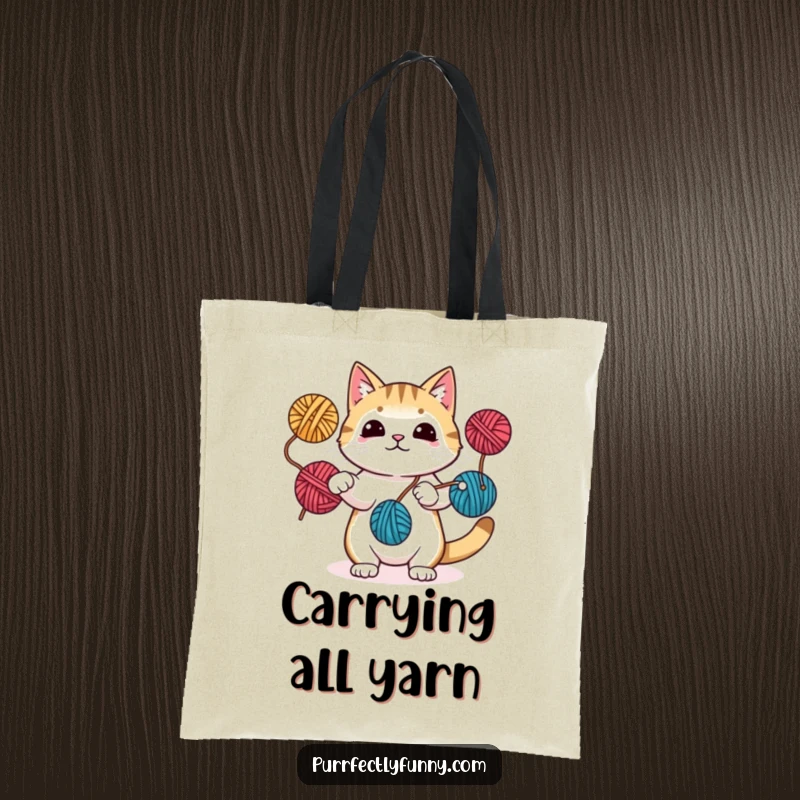 Funny tote bag featuring a cat juggling yarn balls with paws and tail, ideal for carrying essentials with a cheerful, crafty vibe.